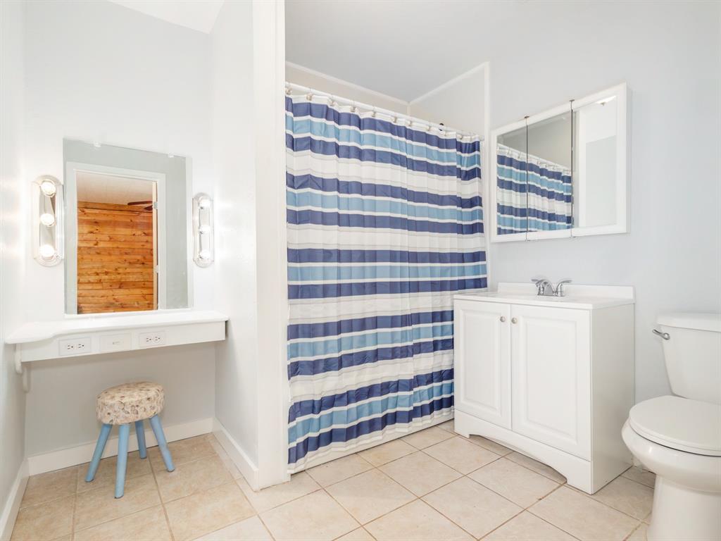 3301 County Road 339 Early, TX 76802 - Photo 8 of 39 a bathroom with a sink toilet and shower