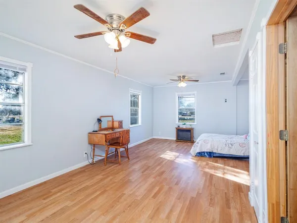 a bedroom with furniture and a window