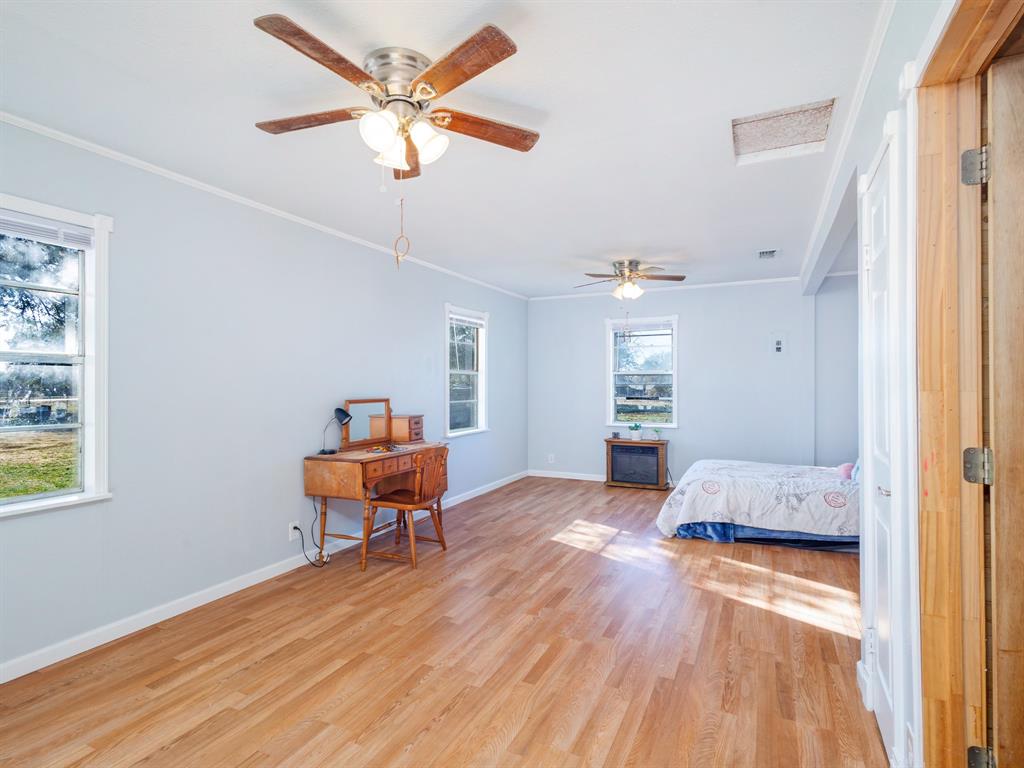 3301 County Road 339 Early, TX 76802 - Photo 10 of 39 a bedroom with furniture and a window