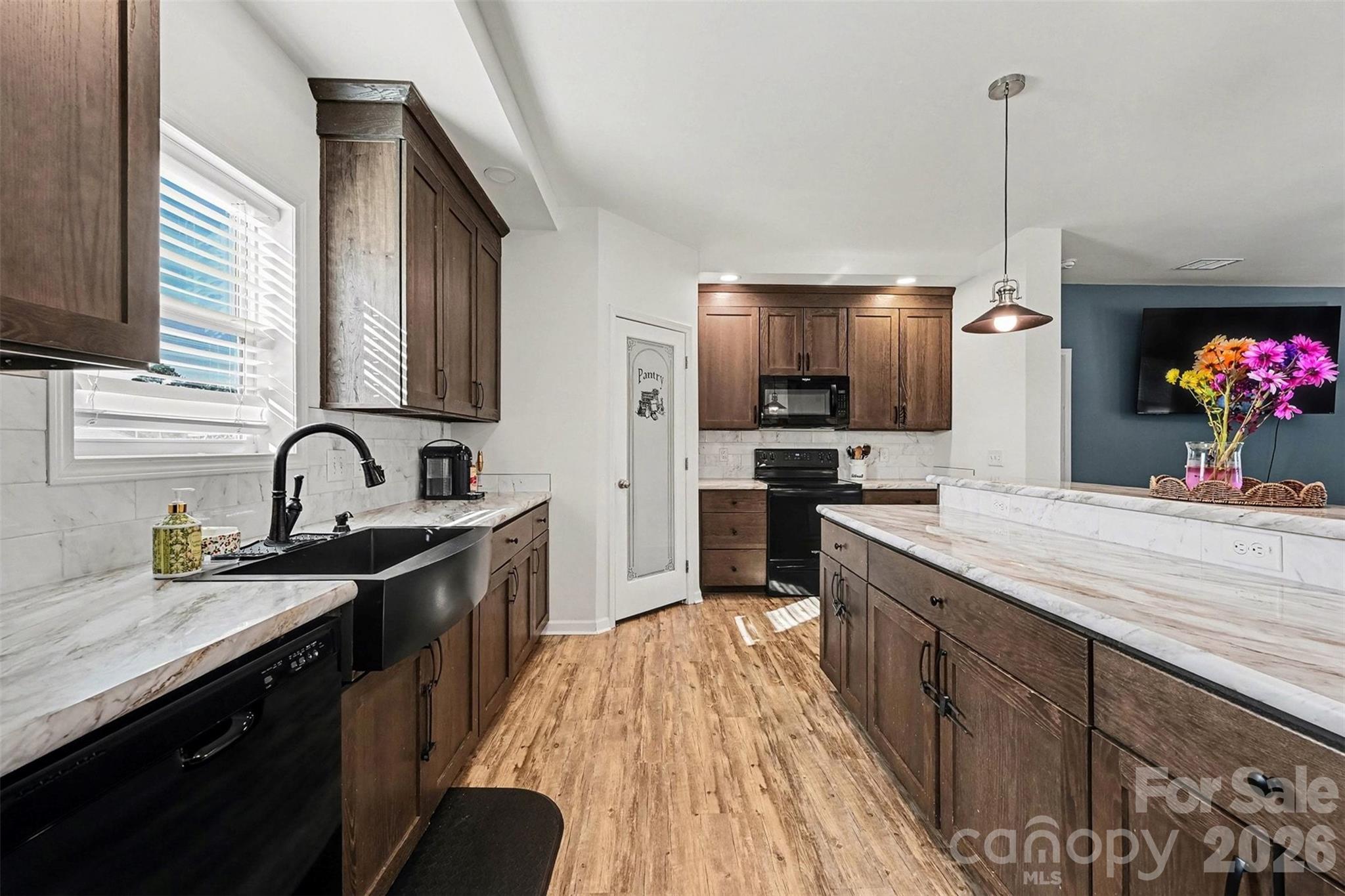 2268 Westbrook Road Edgemoor, SC 29712 - Photo 11 of 37 a kitchen with kitchen island granite countertop a sink stainless steel appliances and cabinets