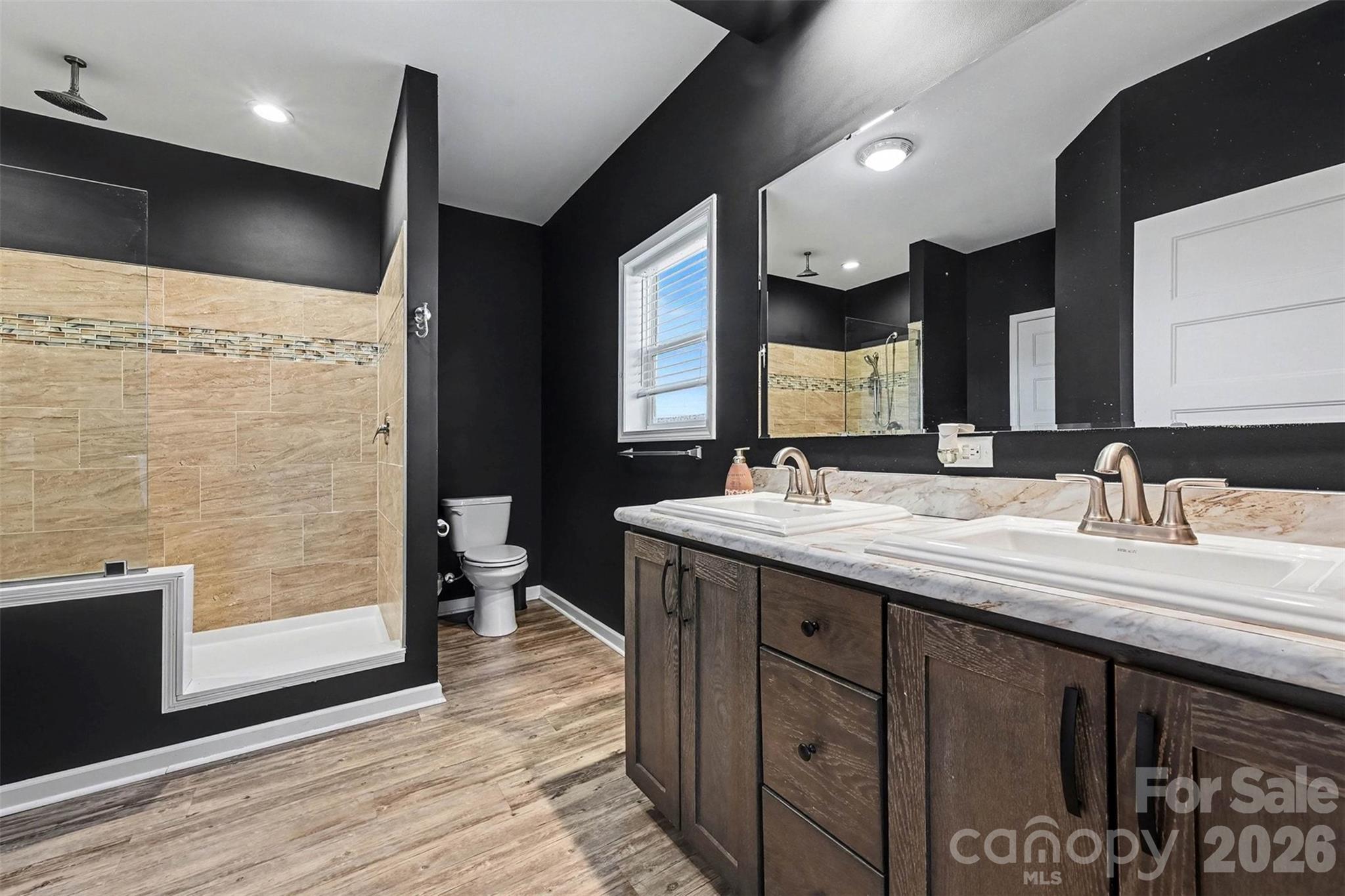 2268 Westbrook Road Edgemoor, SC 29712 - Photo 17 of 37 a bathroom with a double vanity sink and a mirror
