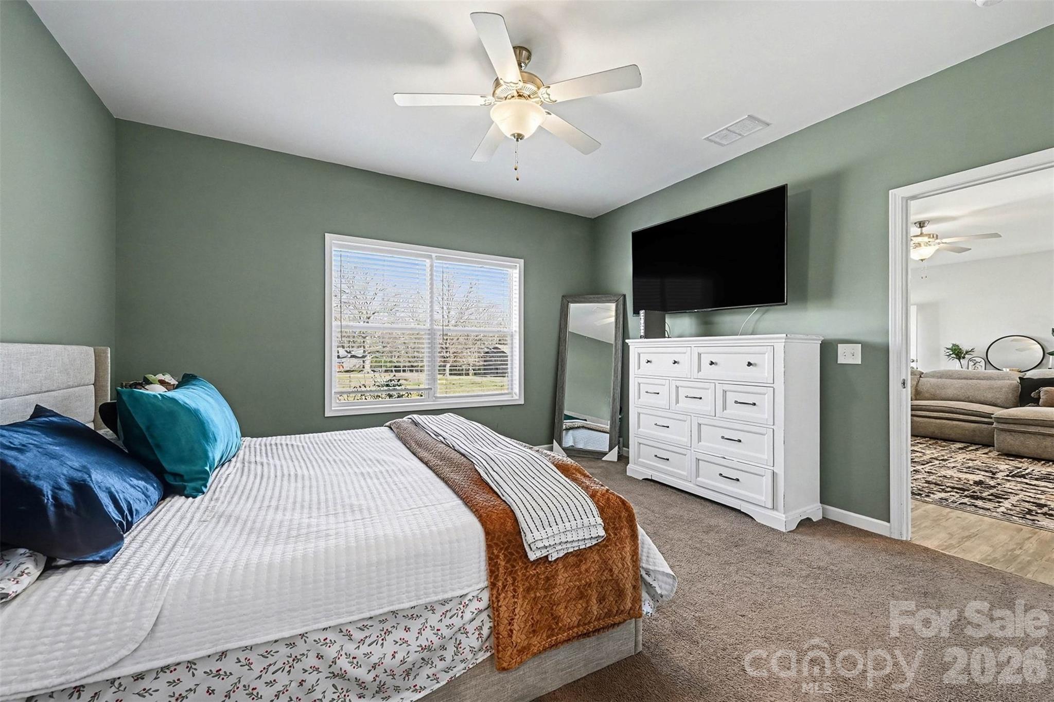 2268 Westbrook Road Edgemoor, SC 29712 - Photo 18 of 37 a bedroom with a bed a television and a dresser