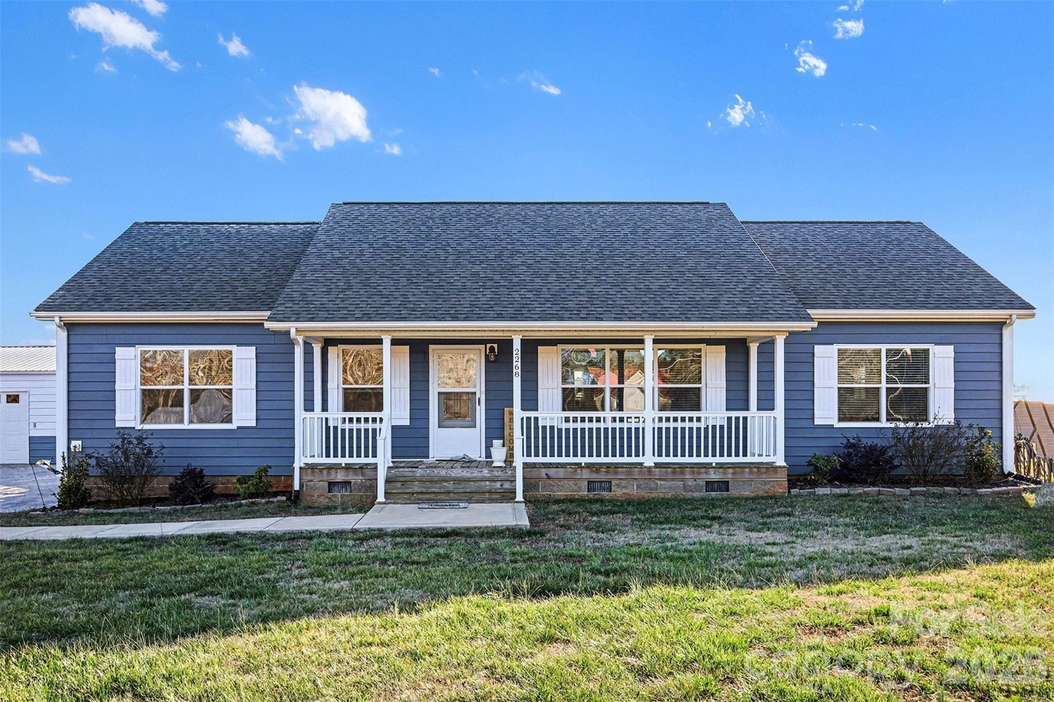 2268 Westbrook Road Edgemoor, SC 29712 - Photo 2 of 37 a front view of a house with garden