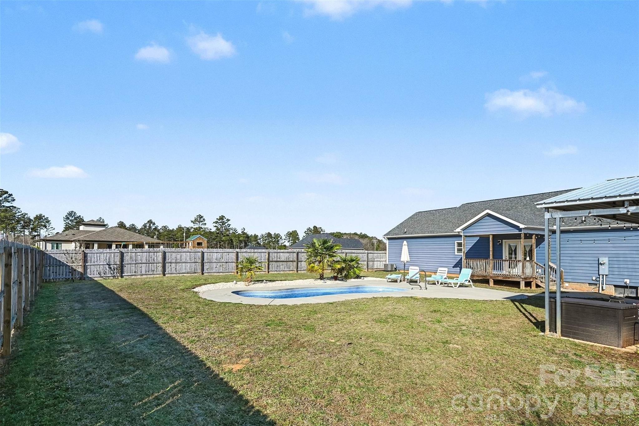 2268 Westbrook Road Edgemoor, SC 29712 - Photo 26 of 37 a swimming pool with outdoor seating and yard