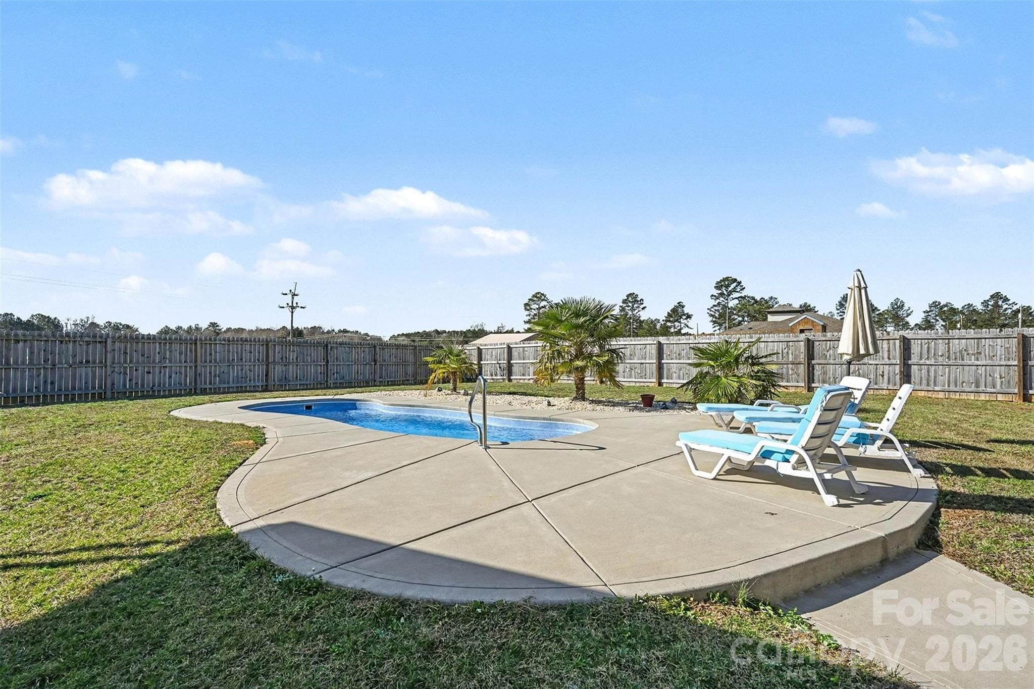 2268 Westbrook Road Edgemoor, SC 29712 - Photo 27 of 37 a view of a swimming pool with a lounge chairs