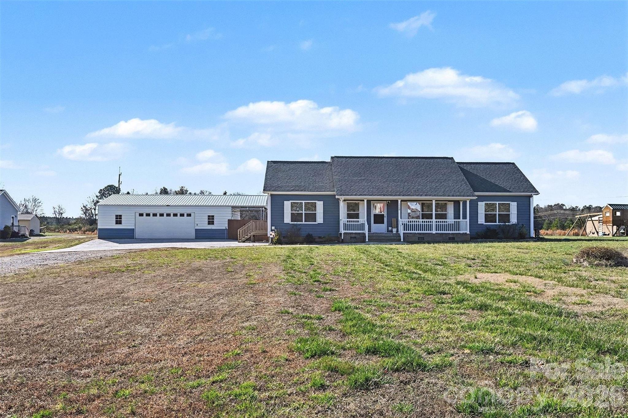 2268 Westbrook Road Edgemoor, SC 29712 - Photo 30 of 37 a view of a house with a yard and sitting area