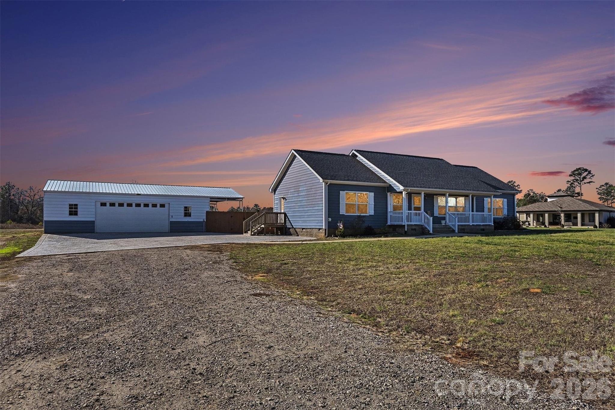 2268 Westbrook Road Edgemoor, SC 29712 - Photo 3 of 37 a house with huge green field in front of it