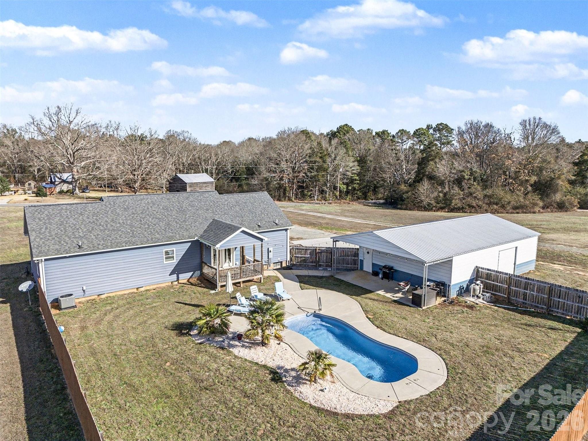 2268 Westbrook Road Edgemoor, SC 29712 - Photo 36 of 38 an aerial view of a house with swimming pool and mountains