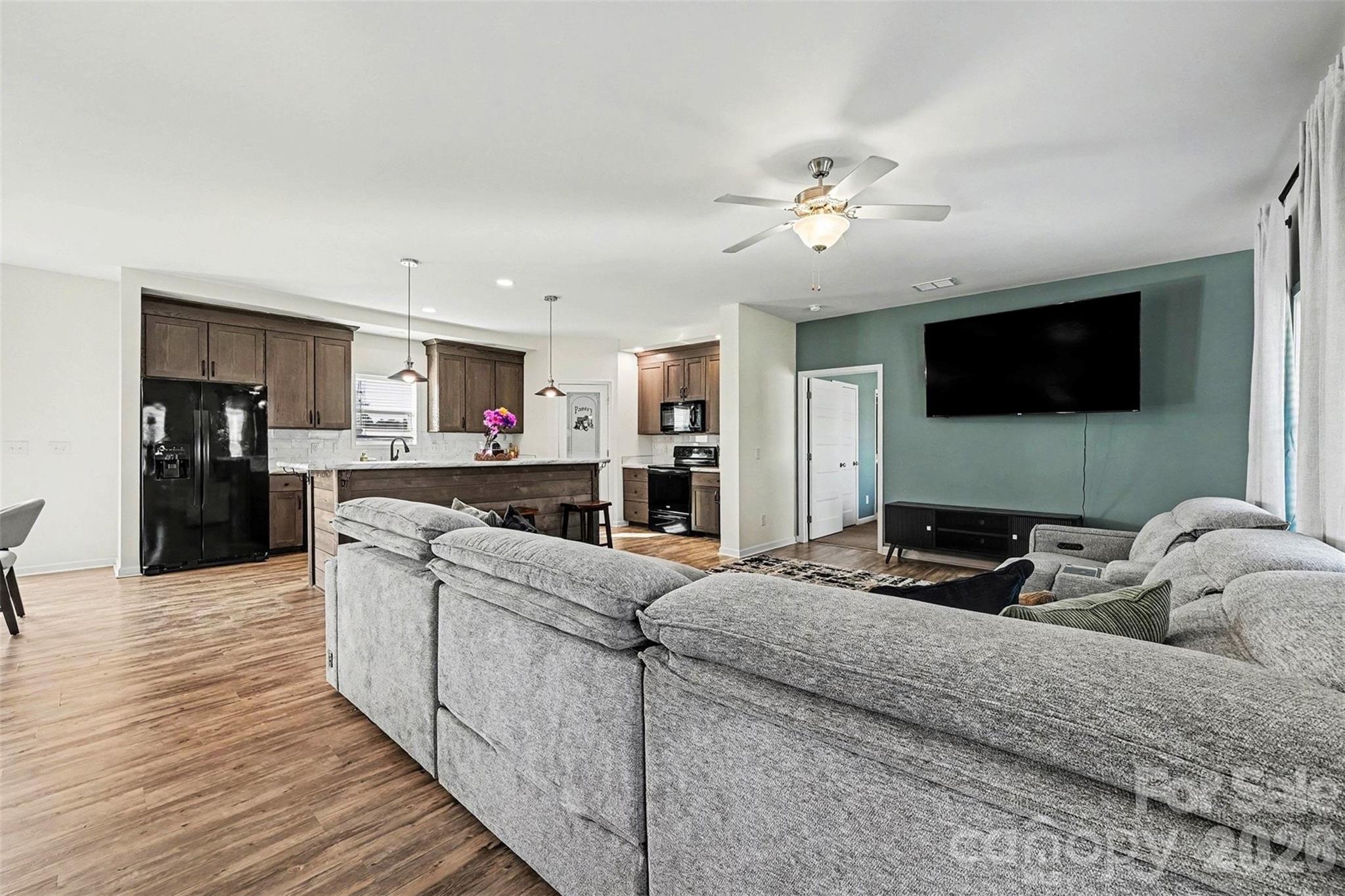 2268 Westbrook Road Edgemoor, SC 29712 - Photo 6 of 37 a living room with furniture and a flat screen tv