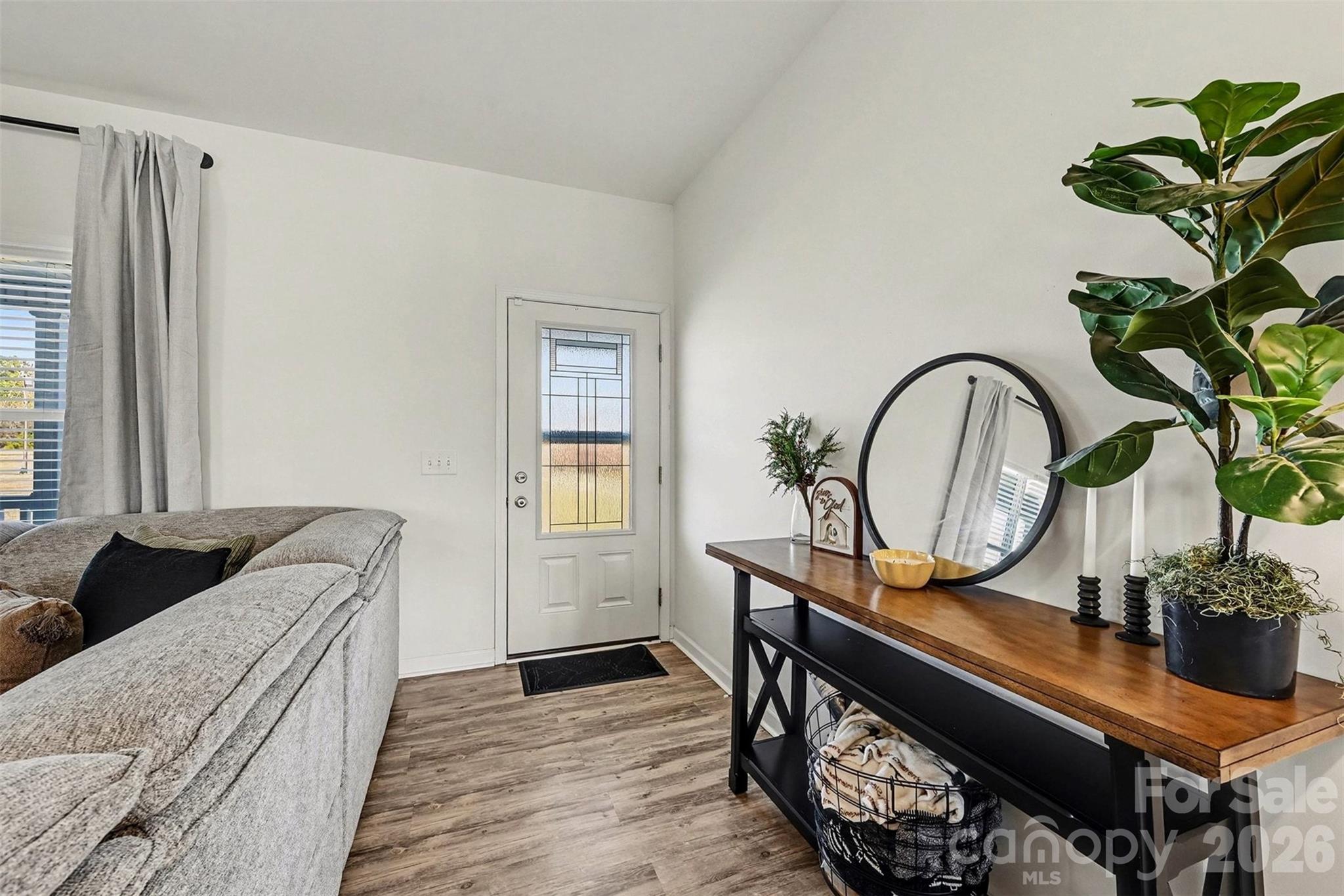 2268 Westbrook Road Edgemoor, SC 29712 - Photo 8 of 37 a living room with furniture a potted plant and a wooden floor
