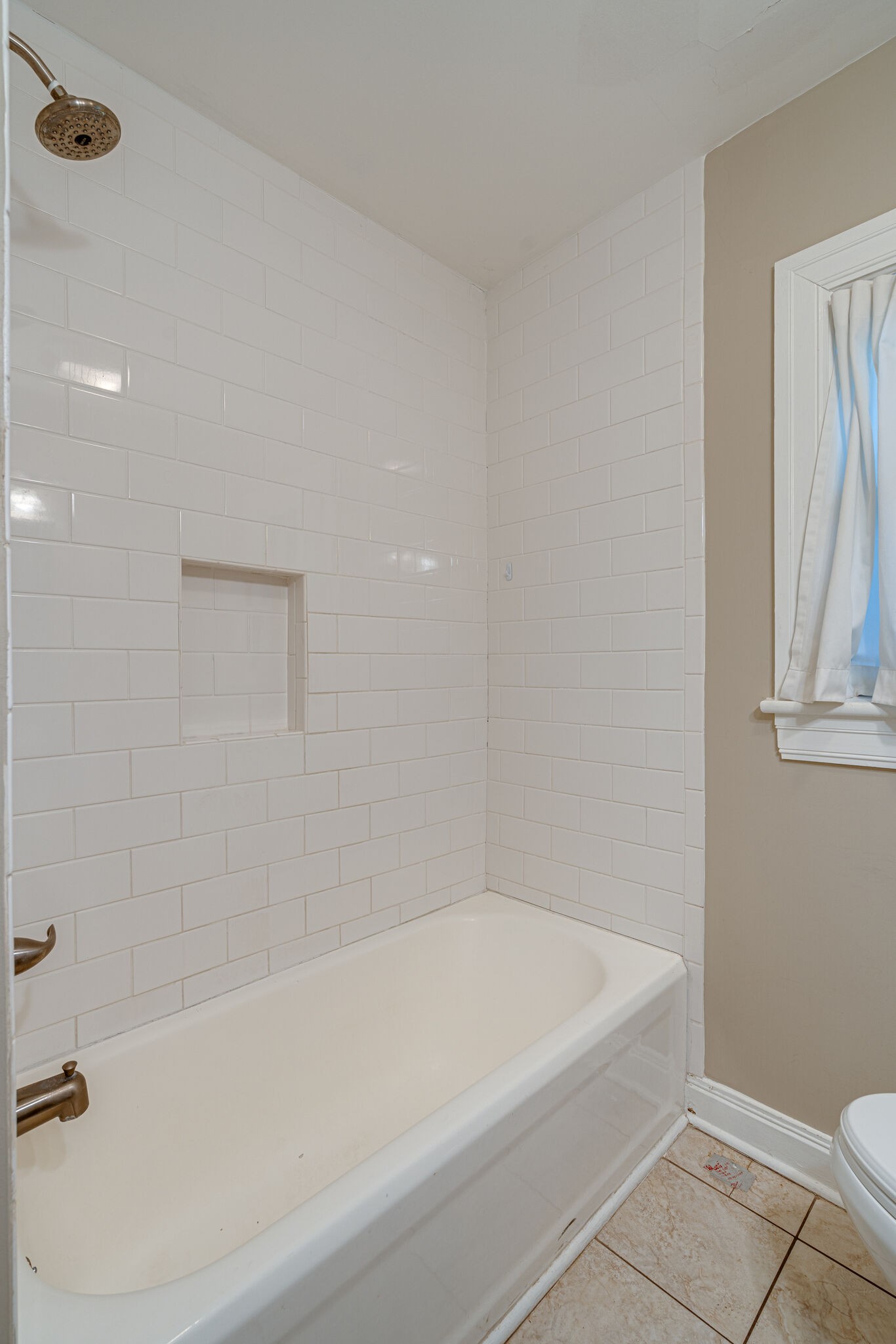 106 Winslow Road Franklin, TN 37064 - Photo 23 of 37 a white bath tub sitting next to a white toilet