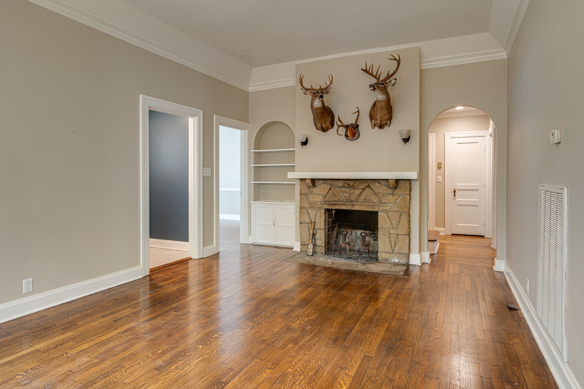 106 Winslow Road Franklin, TN 37064 - Photo 5 of 37 an empty room with wooden floor and a fireplace
