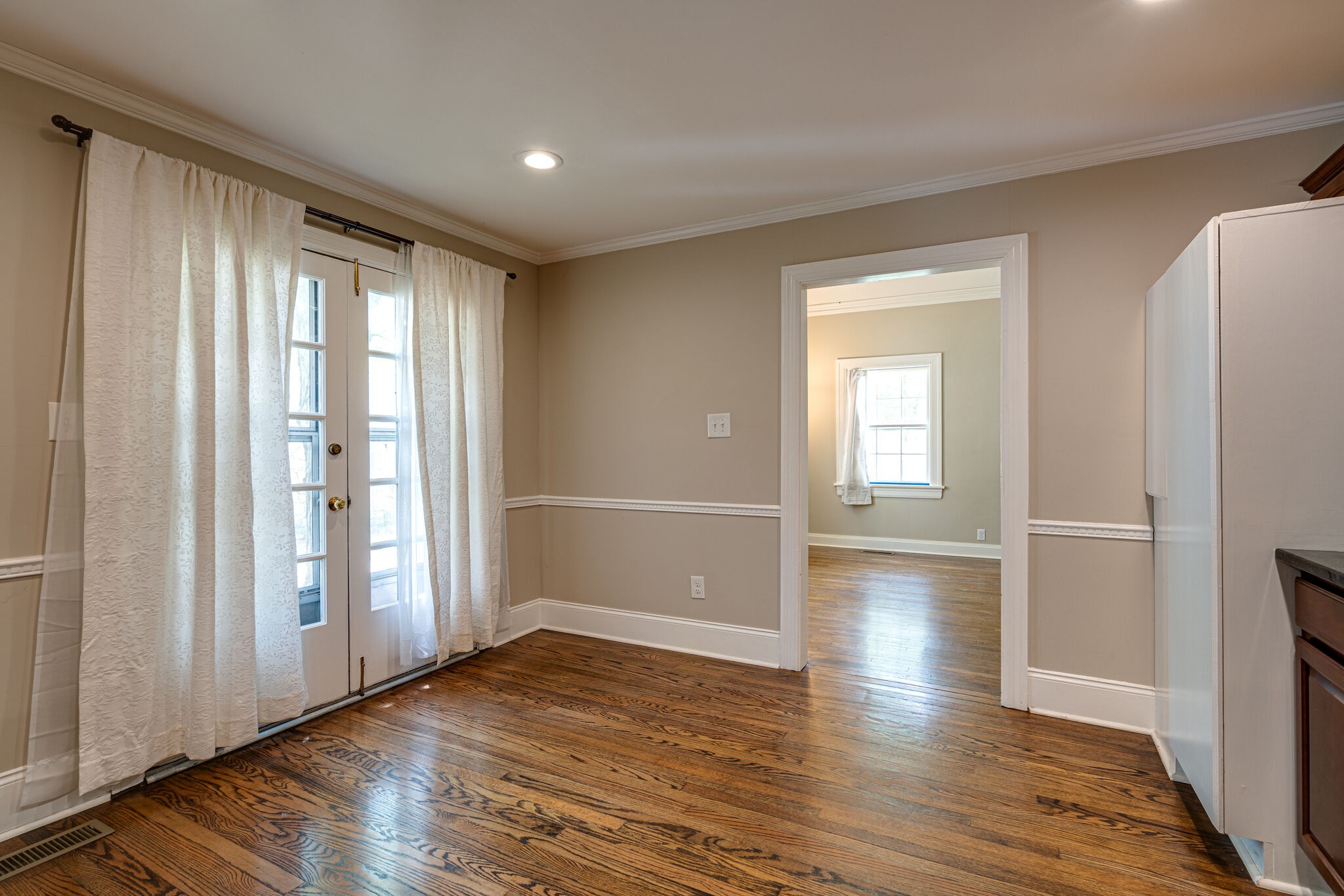 106 Winslow Road Franklin, TN 37064 - Photo 9 of 37 a view of empty room with wooden floor and fan
