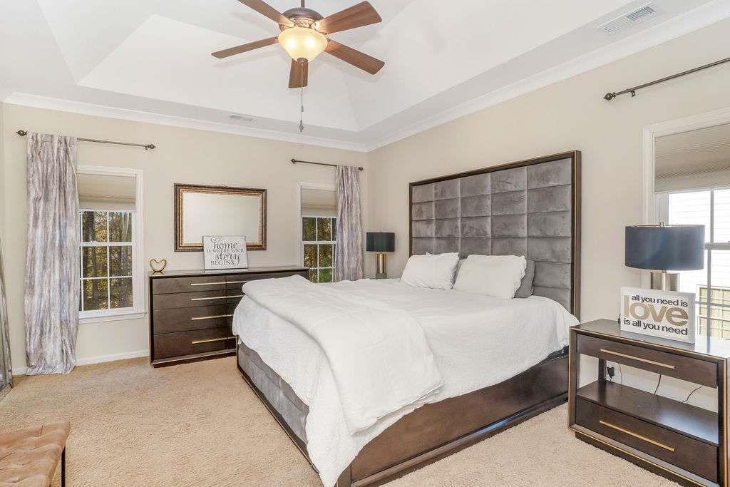 6463 Century Park Place Southeast Mableton, GA 30126 - Photo 20 of 42 a bedroom with a bed and a dresser