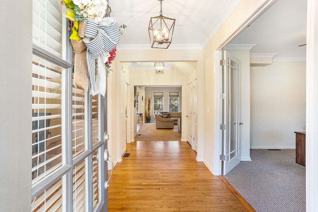 6463 Century Park Place Southeast Mableton, GA 30126 - Photo 2 of 42 a view of a hallway with wooden floor and staircase