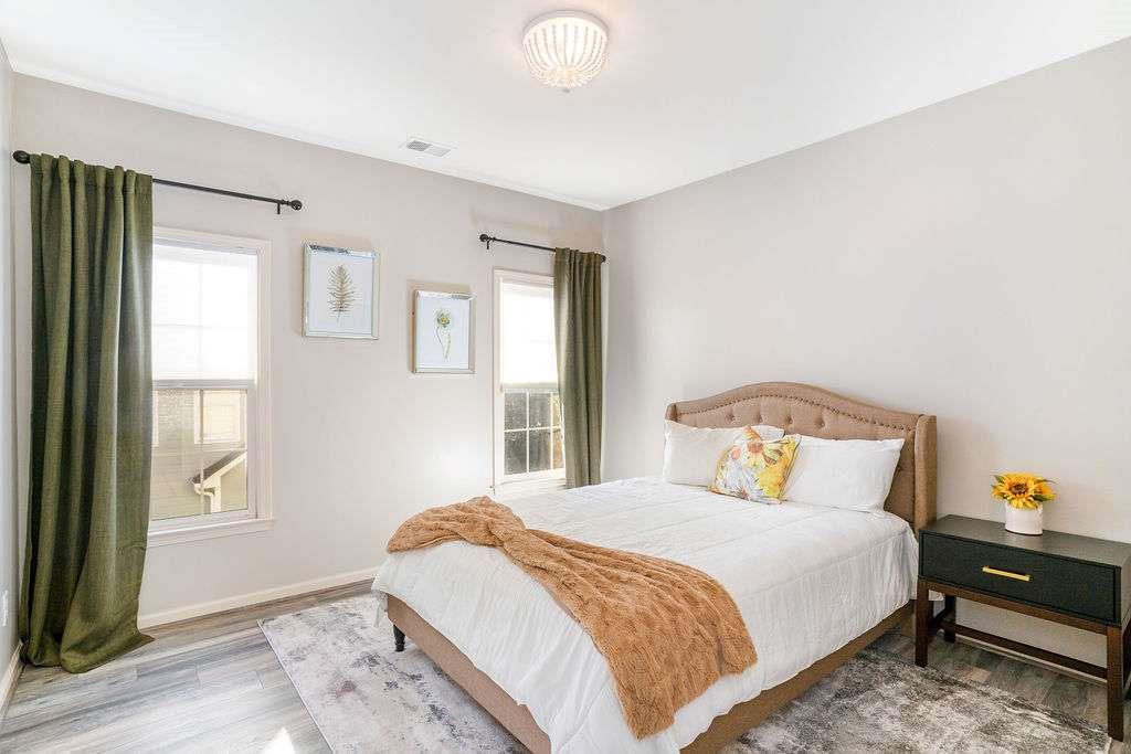 6463 Century Park Place Southeast Mableton, GA 30126 - Photo 25 of 42 a bedroom with a bed and wooden floor