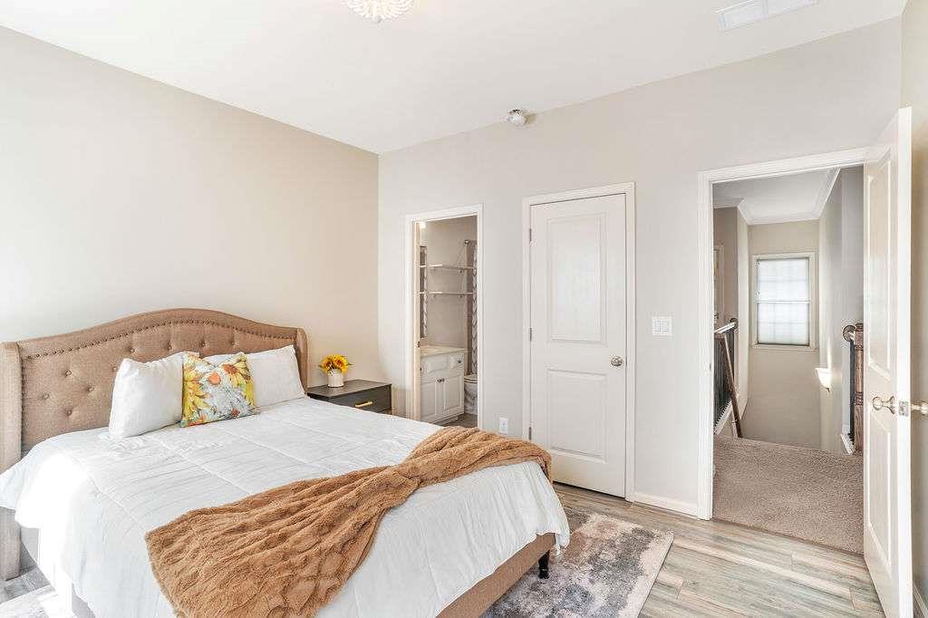 6463 Century Park Place Southeast Mableton, GA 30126 - Photo 26 of 42 a bedroom with a bed and wooden floor