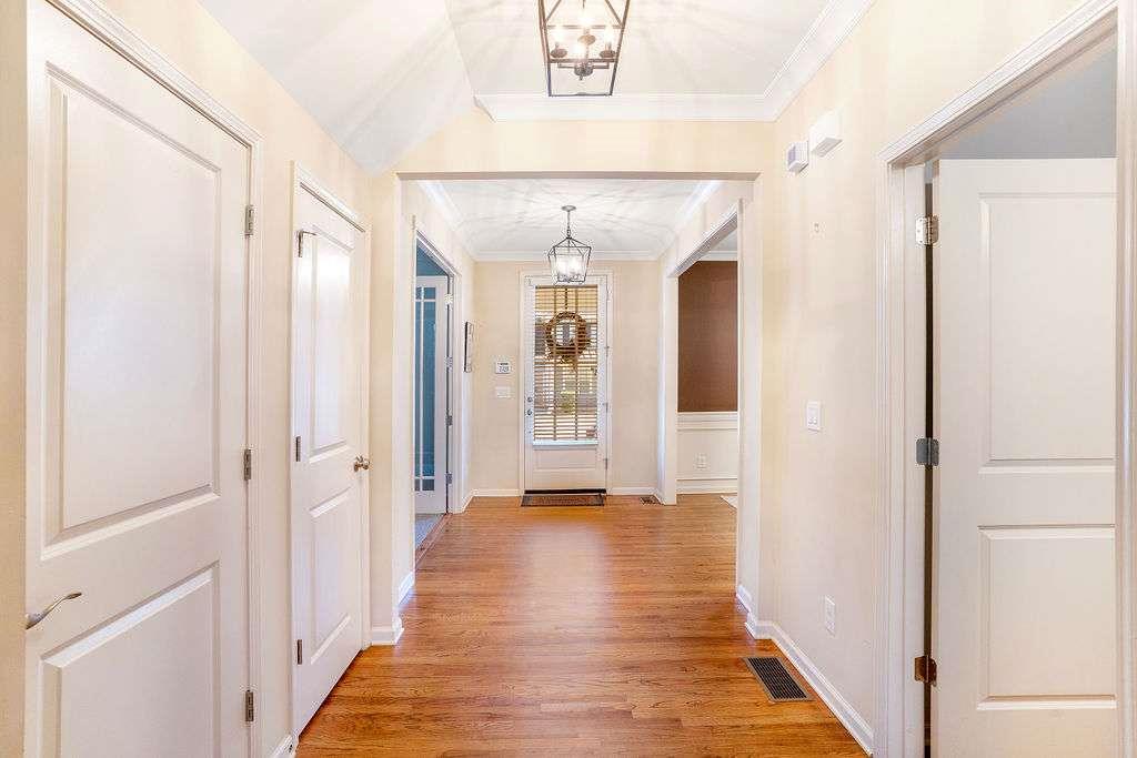 6463 Century Park Place Southeast Mableton, GA 30126 - Photo 3 of 42 a view of a hallway with wooden floor and staircase