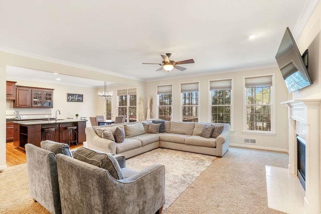 6463 Century Park Place Southeast Mableton, GA 30126 - Photo 10 of 42 a living room with furniture a fireplace and a flat screen tv