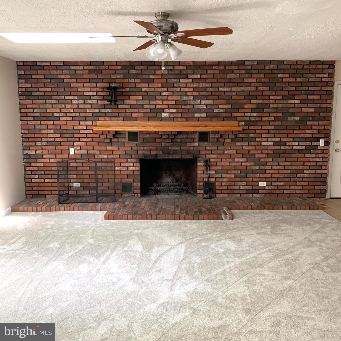 5715 Pindell Road Lothian, MD 20711 - Photo 15 of 25 Rec Room with Fireplace