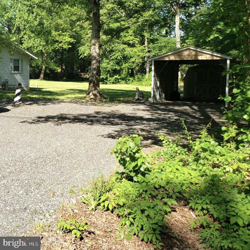 5715 Pindell Road Lothian, MD 20711 - Photo 24 of 25 Right side of the house lots of parking & carport