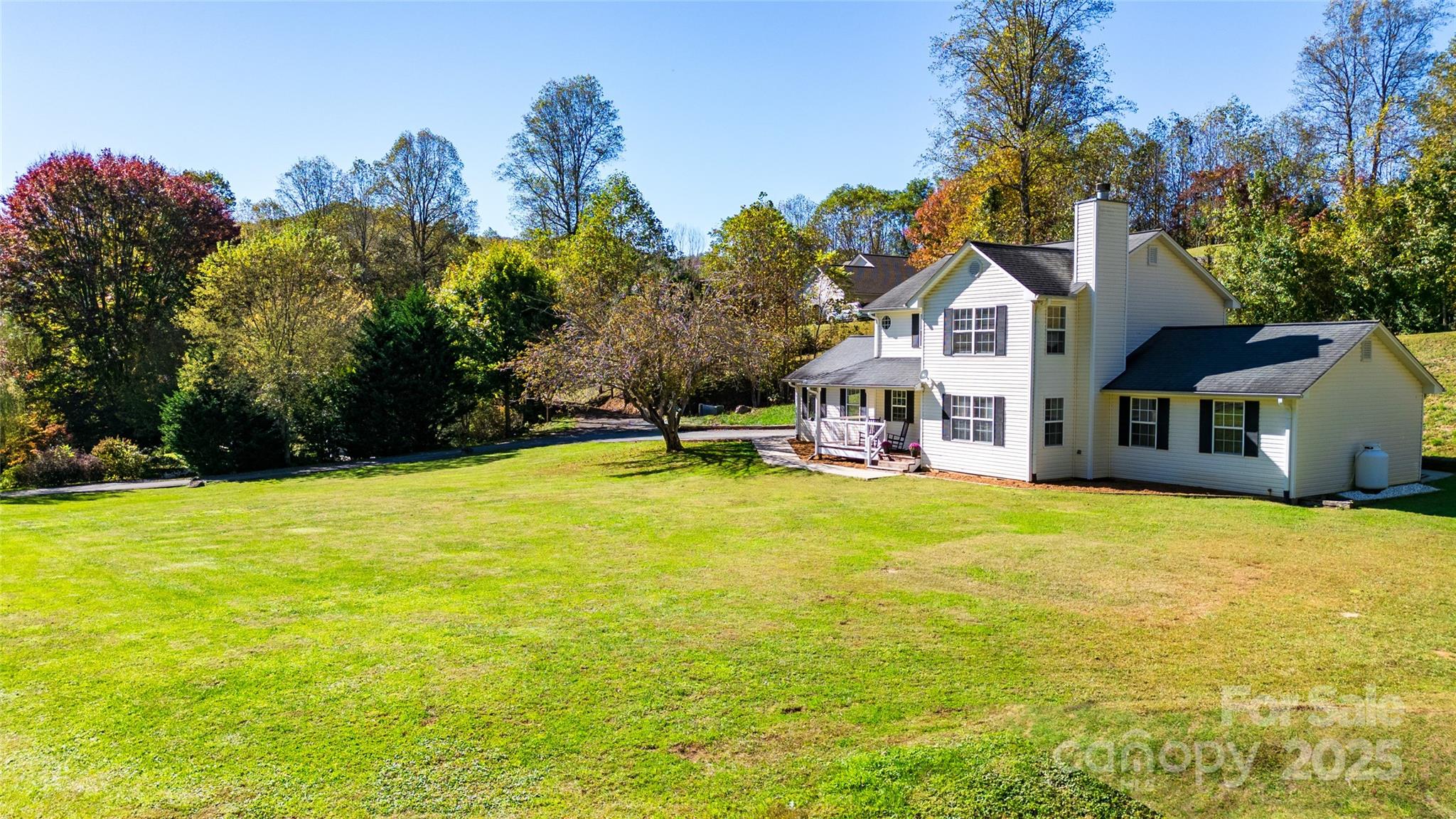 32 Wheat Ridge Road Sylva, NC 28779 - Photo 28 of 44 a view of a house with a yard and basketball court