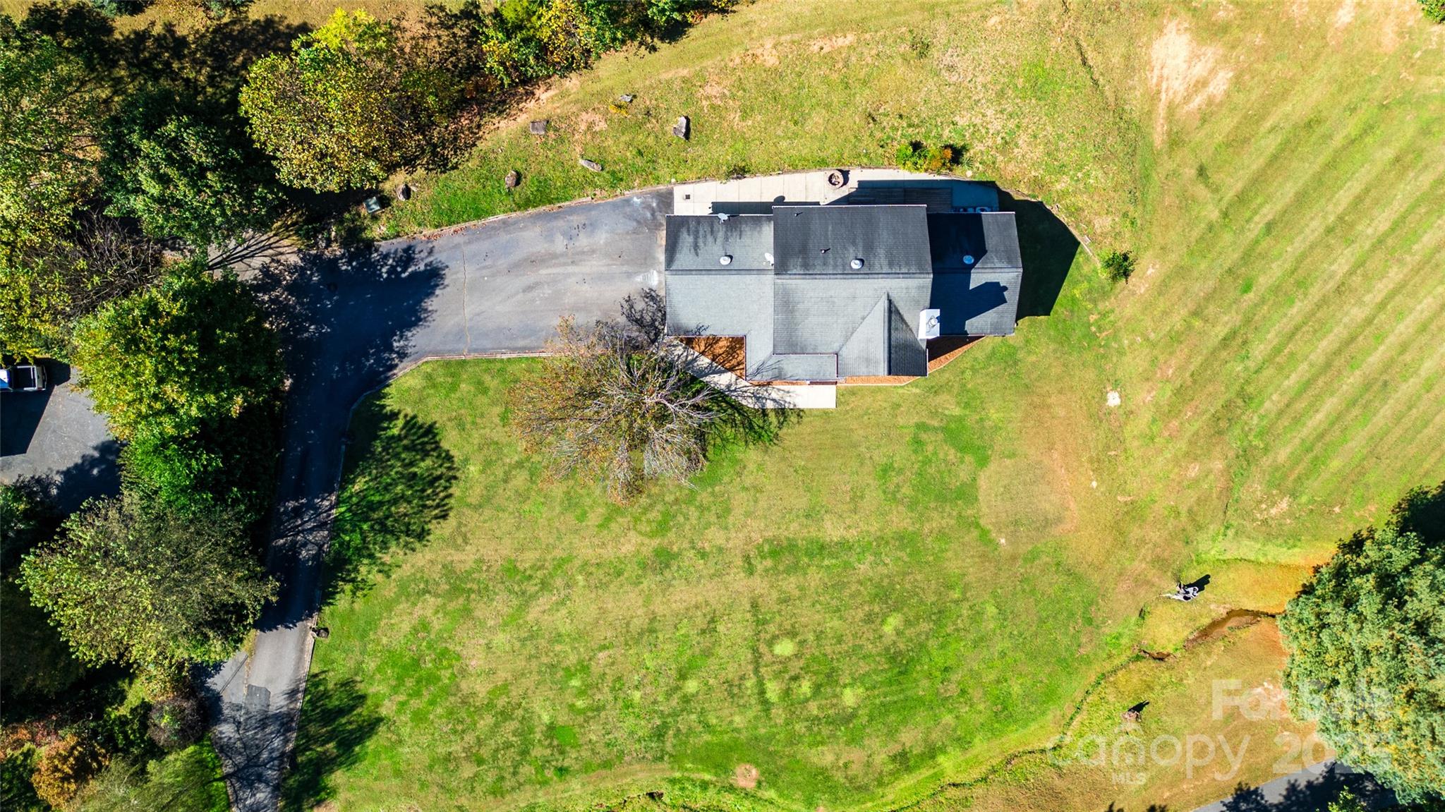 32 Wheat Ridge Road Sylva, NC 28779 - Photo 30 of 44 an aerial view of a house with a yard