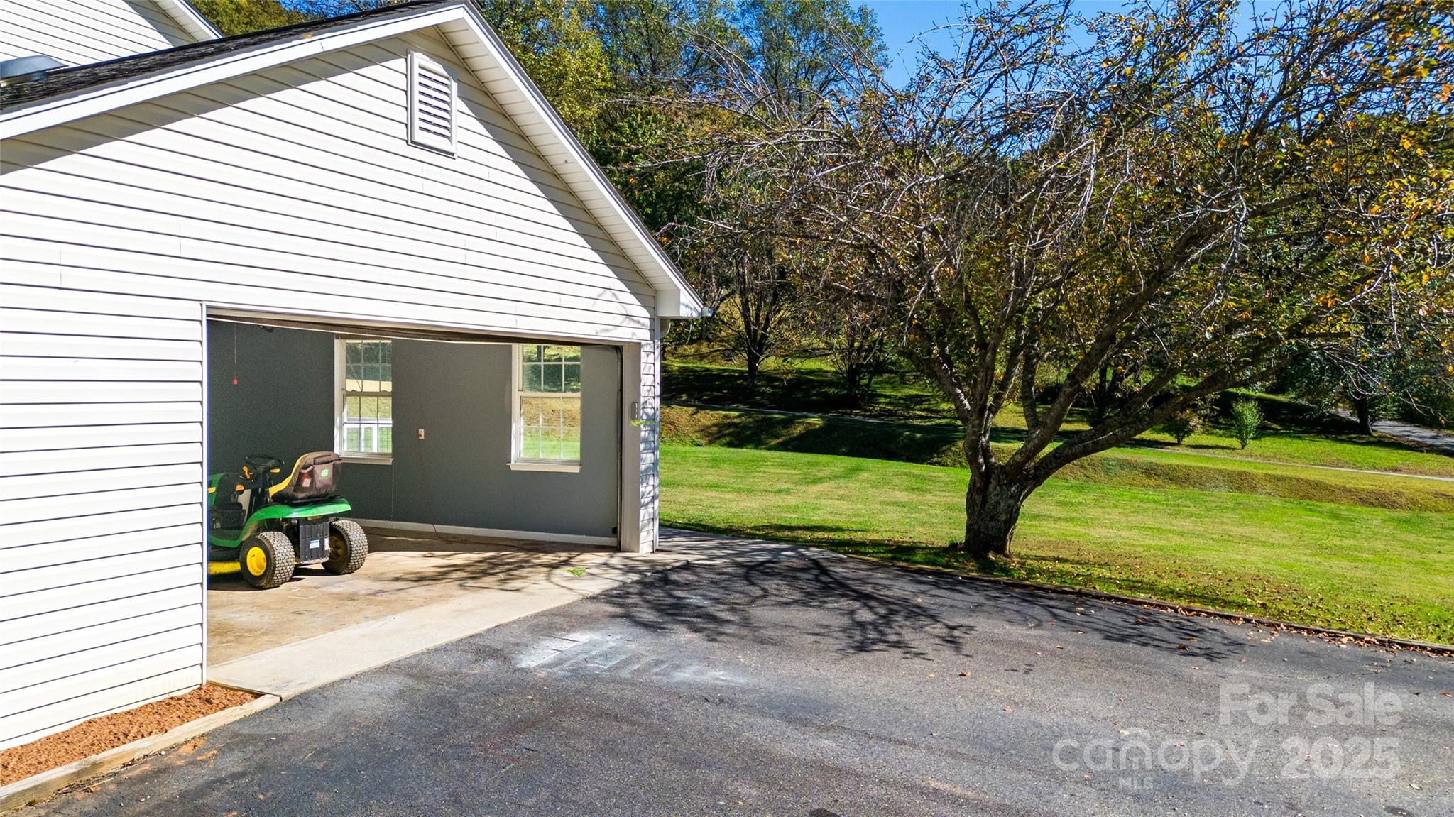 32 Wheat Ridge Road Sylva, NC 28779 - Photo 33 of 44 a view of a house with backyard and sitting area