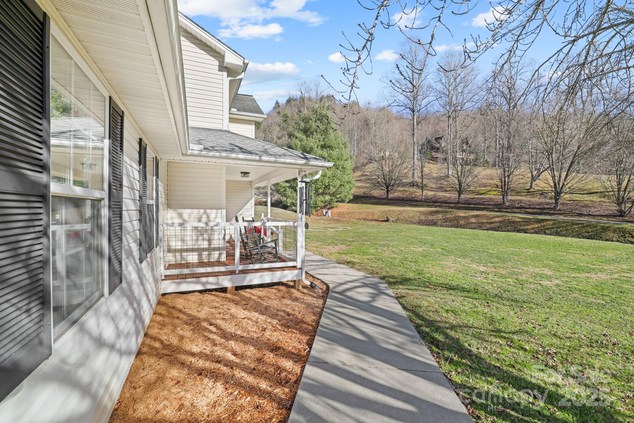 32 Wheat Ridge Road Sylva, NC 28779 - Photo 34 of 44 a view of a patio with a yard