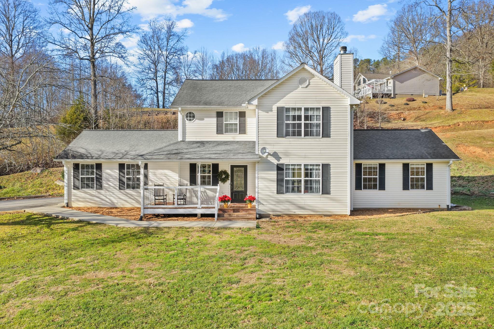 32 Wheat Ridge Road Sylva, NC 28779 - Photo 38 of 44 a front view of a house with a yard table and chairs