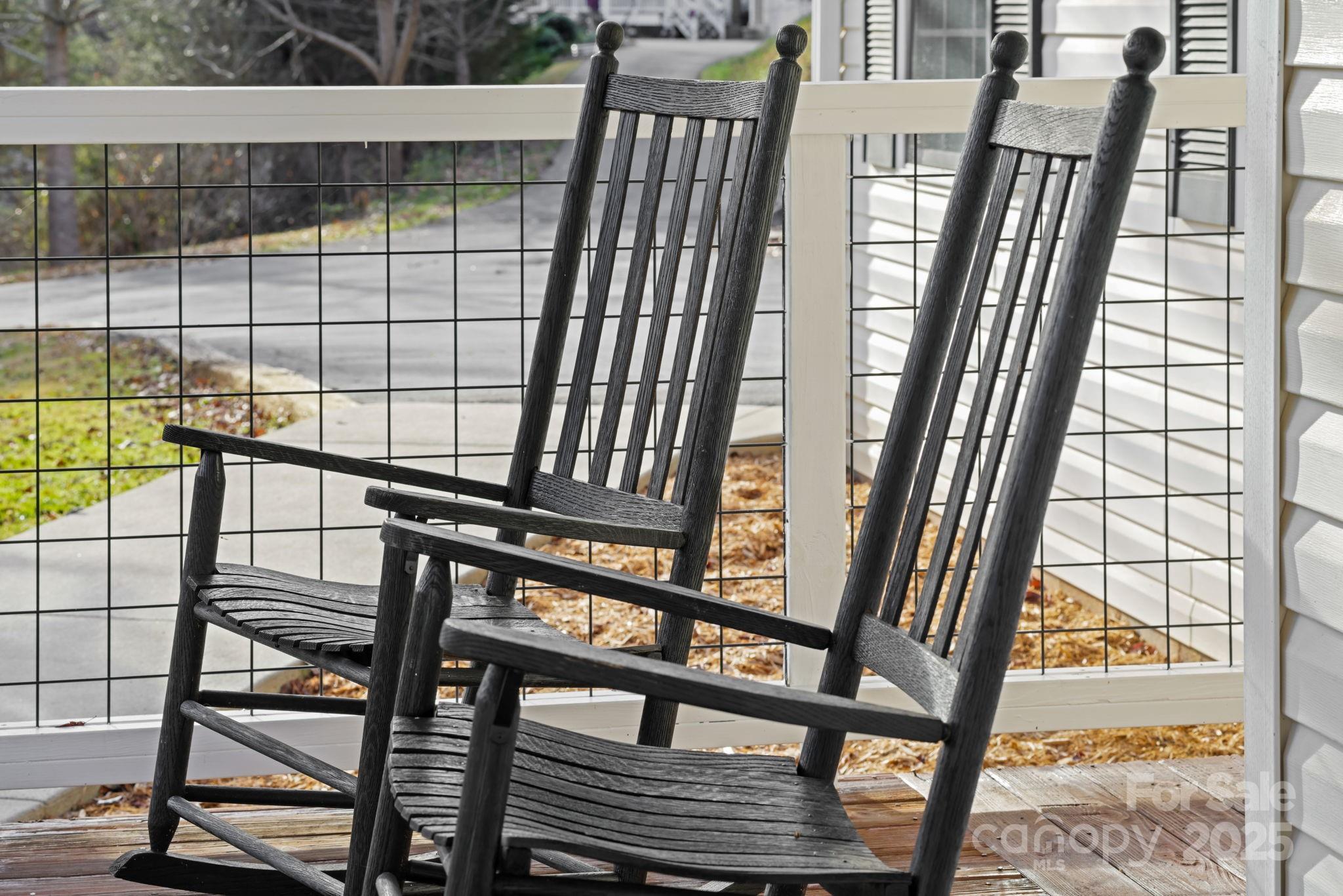 32 Wheat Ridge Road Sylva, NC 28779 - Photo 40 of 44 a view of a balcony with two chairs and a table
