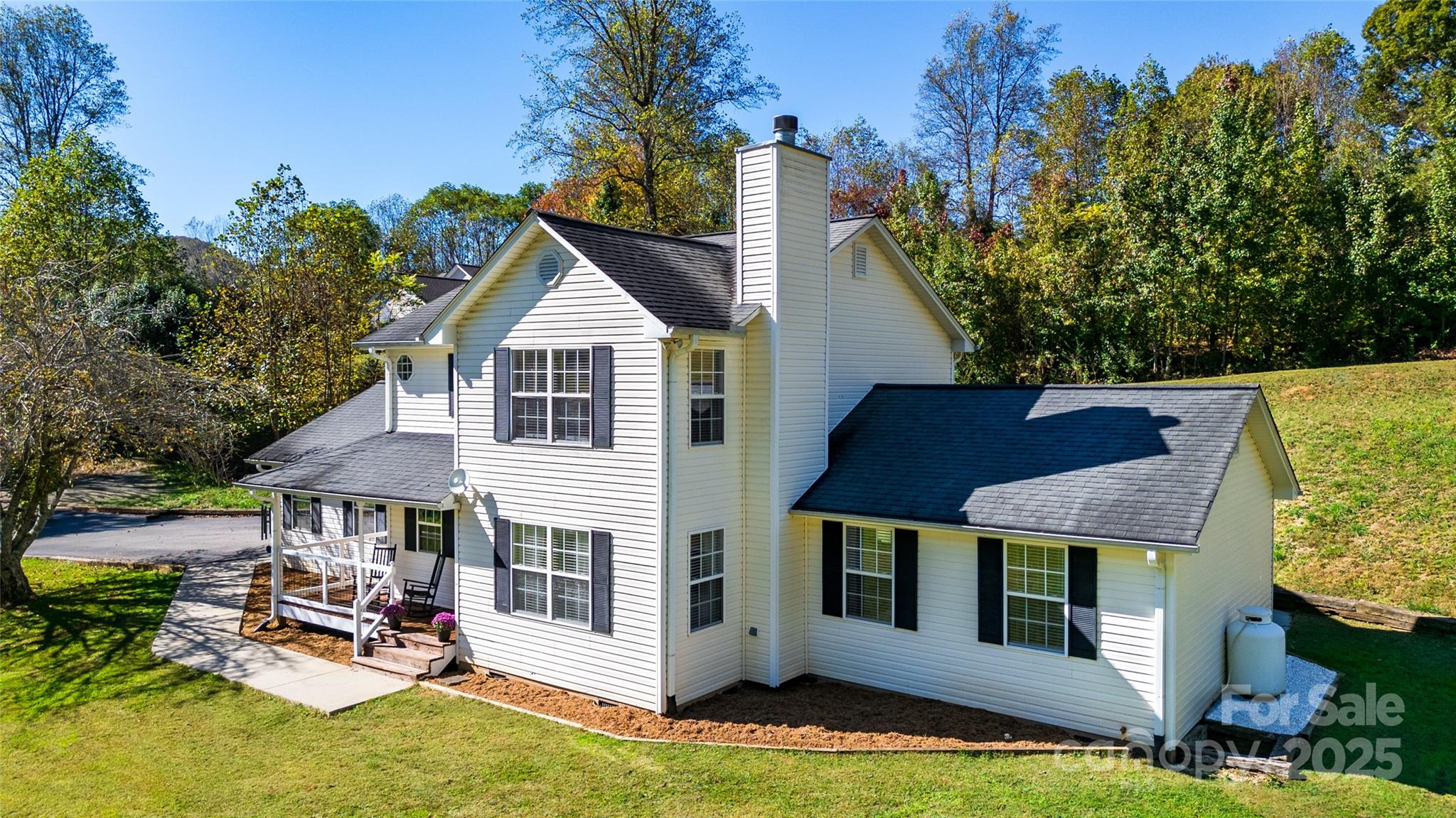 32 Wheat Ridge Road Sylva, NC 28779 - Photo 4 of 44 a house view with a garden space