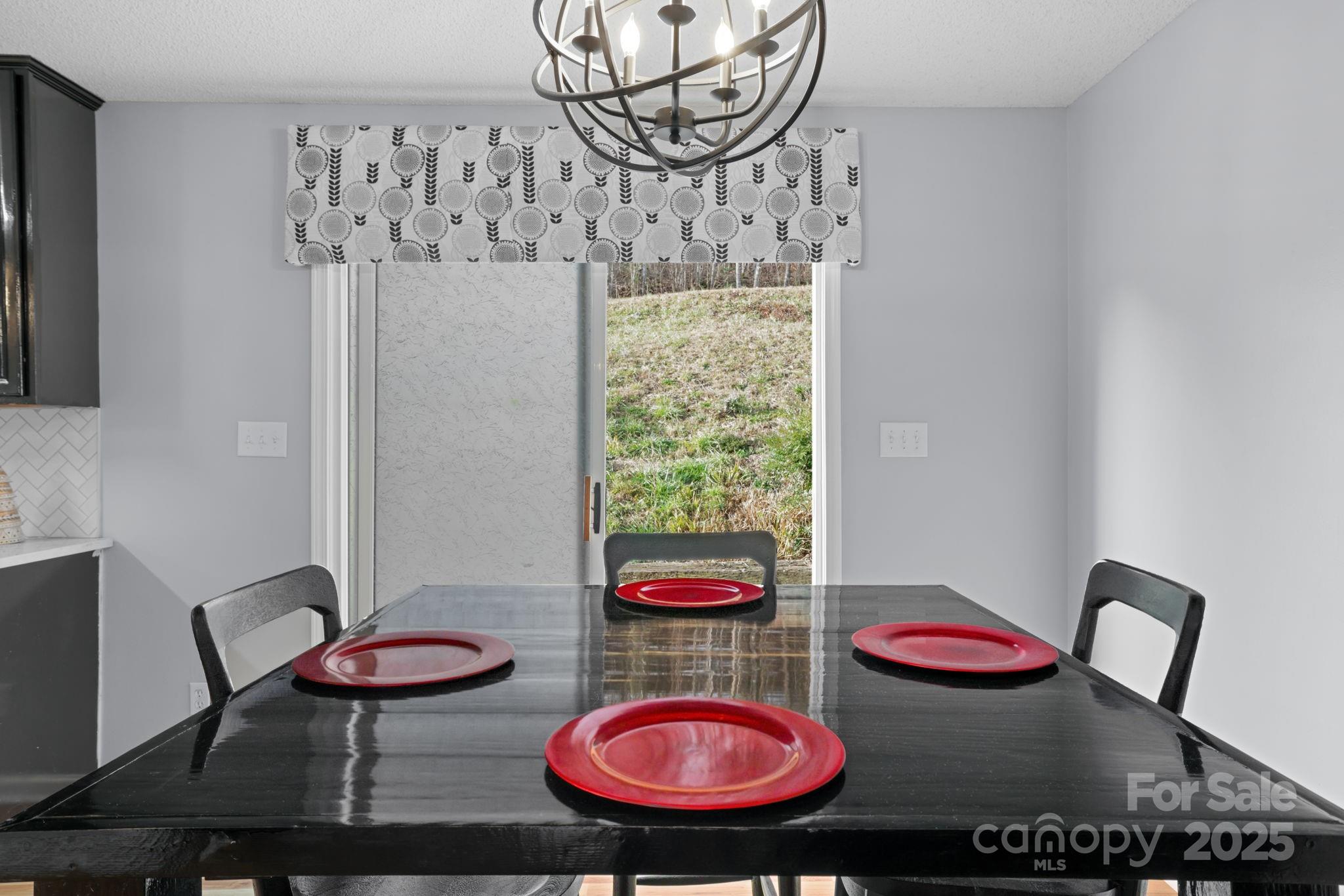 32 Wheat Ridge Road Sylva, NC 28779 - Photo 10 of 44 a view of a dining room with furniture