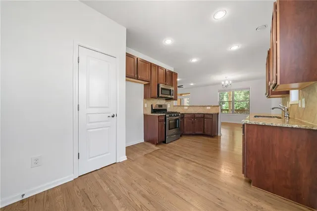 a kitchen with stainless steel appliances a refrigerator and a sink