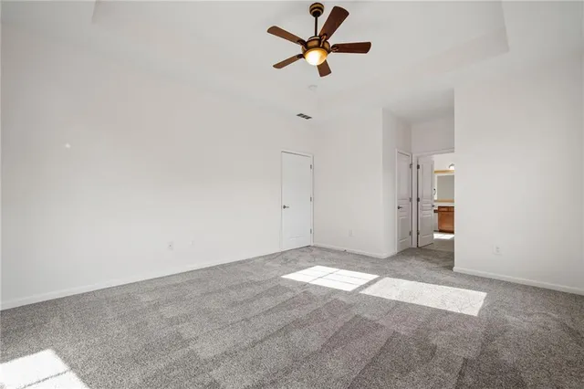 an empty room with fan