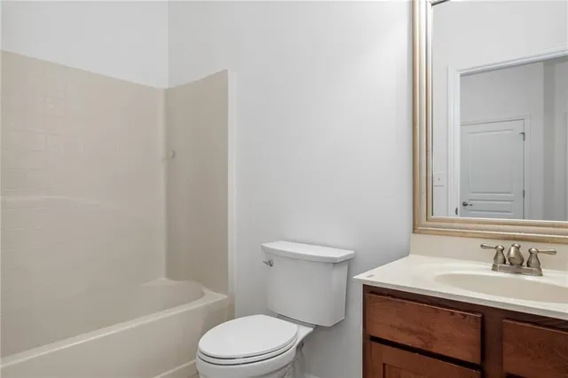 a bathroom with a sink a toilet and a bathtub