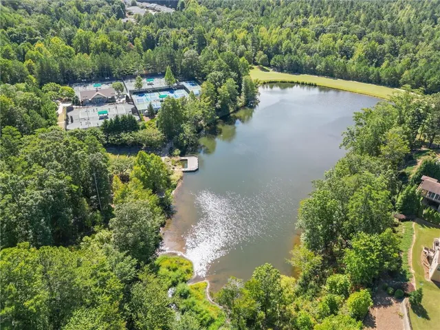 an aerial view of residential house with outdoor space and swimming pool