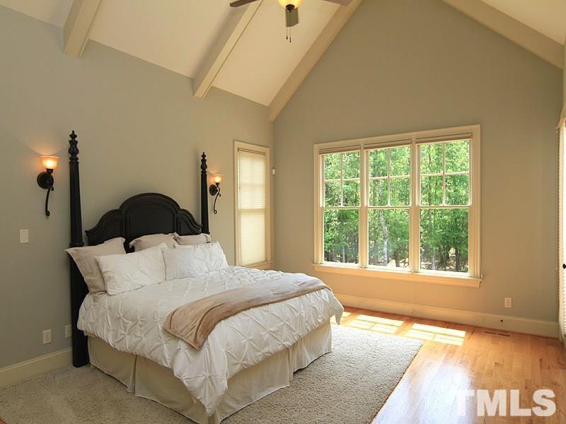 1305 Mason Road Durham, NC 27712 - Photo 15 of 25 a bedroom with a bed and a window