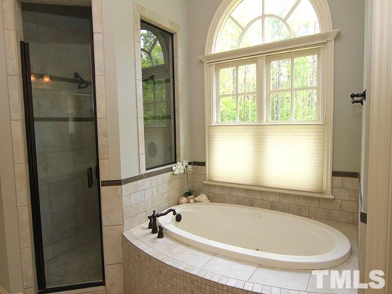 1305 Mason Road Durham, NC 27712 - Photo 16 of 25 a bath tub sitting next to a window