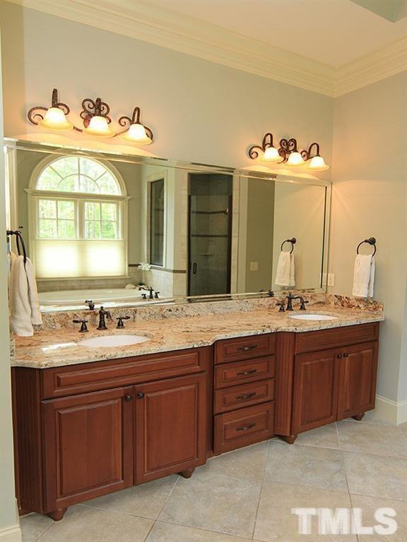 1305 Mason Road Durham, NC 27712 - Photo 17 of 25 a bathroom with a granite countertop sink double and mirror