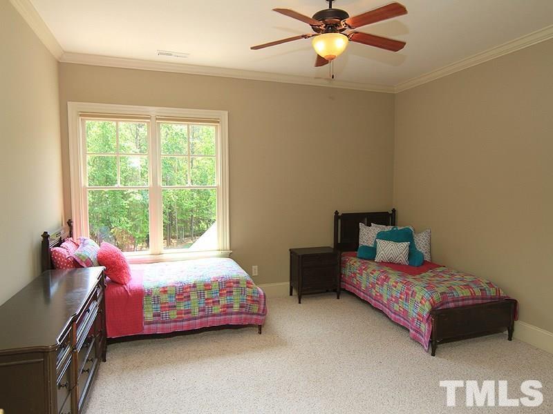 1305 Mason Road Durham, NC 27712 - Photo 19 of 25 a bedroom with a bed and a window