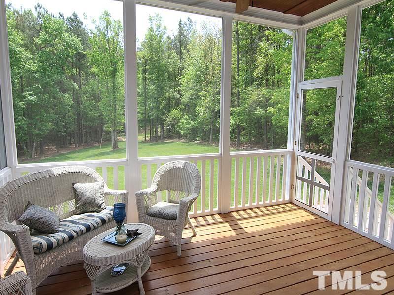 1305 Mason Road Durham, NC 27712 - Photo 21 of 25 a view of a patio with lawn chairs next to a yard