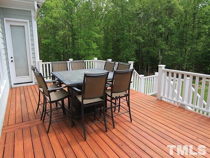 1305 Mason Road Durham, NC 27712 - Photo 22 of 25 a view of a roof deck with table and chairs