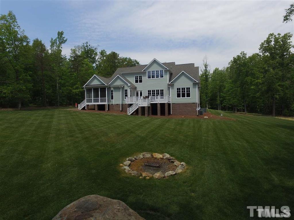 1305 Mason Road Durham, NC 27712 - Photo 23 of 25 a front view of a house with a garden