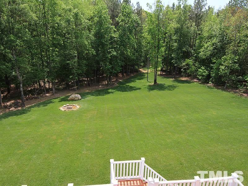 1305 Mason Road Durham, NC 27712 - Photo 25 of 25 a front view of a house with a yard