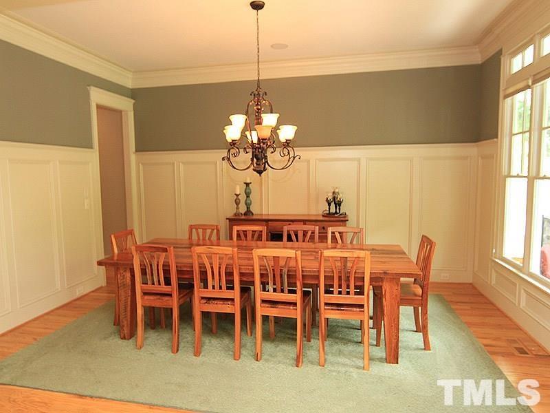 1305 Mason Road Durham, NC 27712 - Photo 8 of 25 a dining room with furniture a chandelier and window