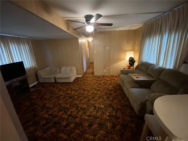 a bed room with a bed window and a chair