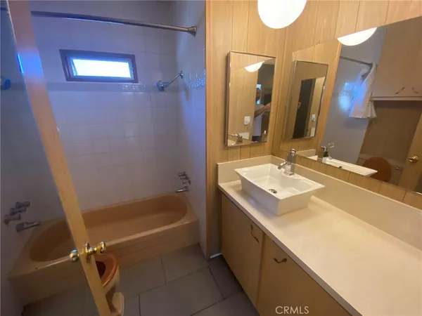 a bathroom with a sink a vanity and mirror