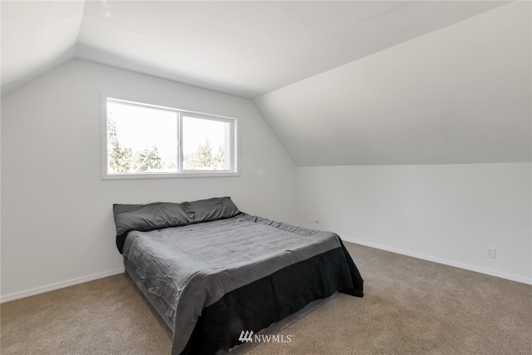 14635 Southeast 140th Place Renton, WA 98059 - Photo 14 of 33 a bedroom with a bed and window