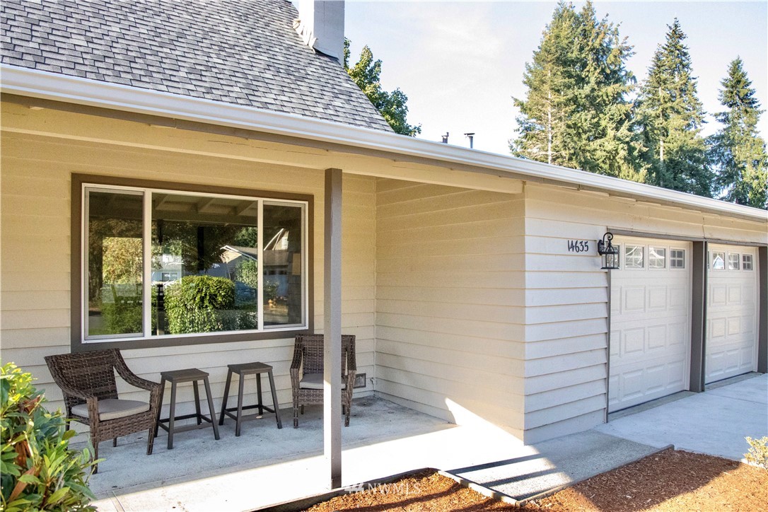 14635 Southeast 140th Place Renton, WA 98059 - Photo 3 of 33 a view of a patio with table and chairs and potted plants